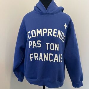 Que Blue Pullover Hoodie with Light Blue Tag